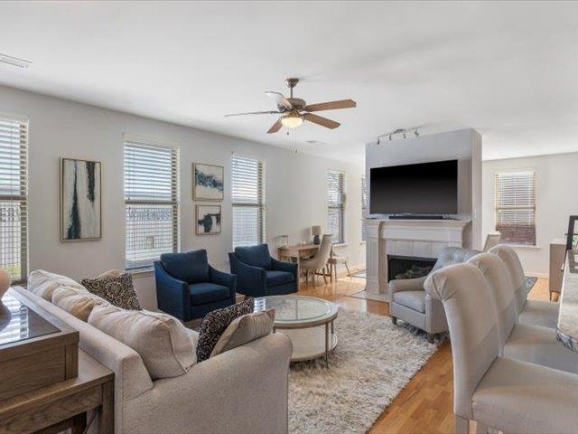 580 South Main Street, Unit 204 Memphis, TN 38103 - Photo 9 of 28 Living area featuring a fireplace, wood finished floors, a ceiling fan, and track lighting