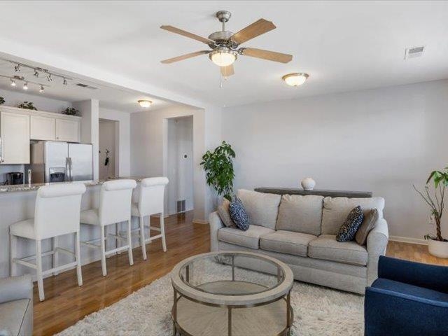 580 South Main Street, Unit 204 Memphis, TN 38103 - Photo 10 of 28 Living room with light wood-style floors and a ceiling fan
