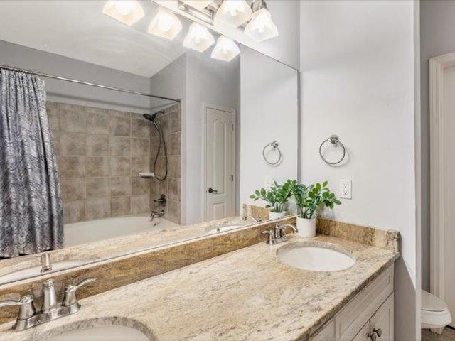 580 South Main Street, Unit 204 Memphis, TN 38103 - Photo 16 of 28 Full bath featuring shower / tub combo and double vanity