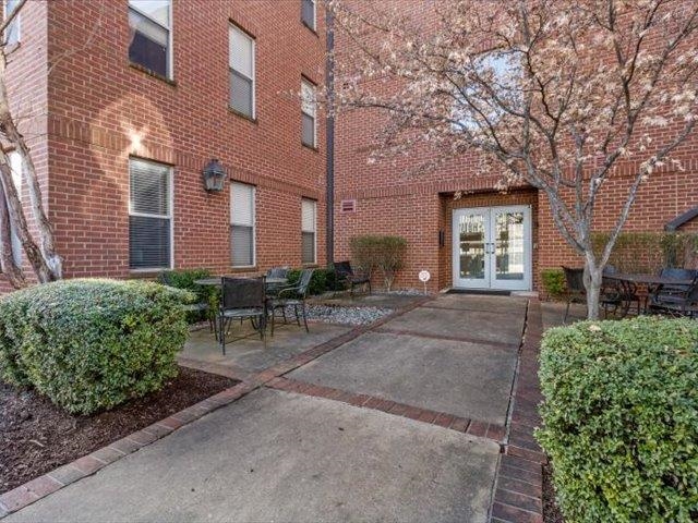 580 South Main Street, Unit 204 Memphis, TN 38103 - Photo 24 of 28 Property entrance with french doors, brick siding, and a patio area