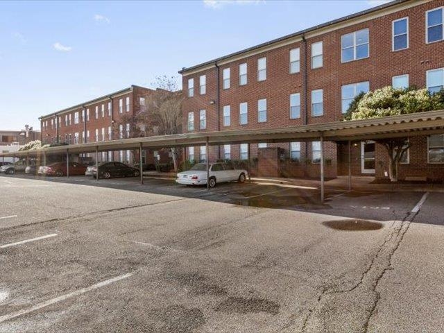 580 South Main Street, Unit 204 Memphis, TN 38103 - Photo 25 of 28 View of apartment building / complex featuring covered parking