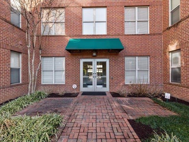 580 South Main Street, Unit 204 Memphis, TN 38103 - Photo 3 of 28 Property entrance featuring french doors, a patio, and brick siding