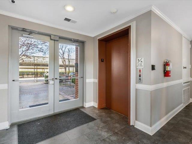 580 South Main Street, Unit 204 Memphis, TN 38103 - Photo 4 of 28 Entryway featuring crown molding, french doors, and elevator