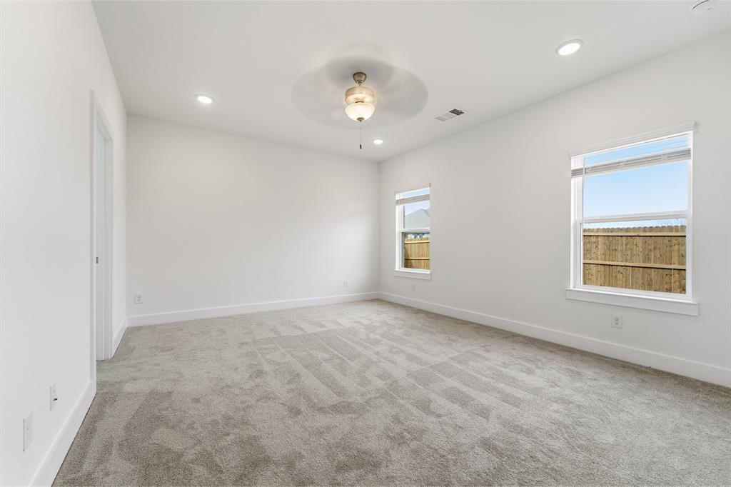 225 Charismatic Road Waxahachie, TX 75165 - Photo 15 of 21 an empty room with a window and a ceiling fan