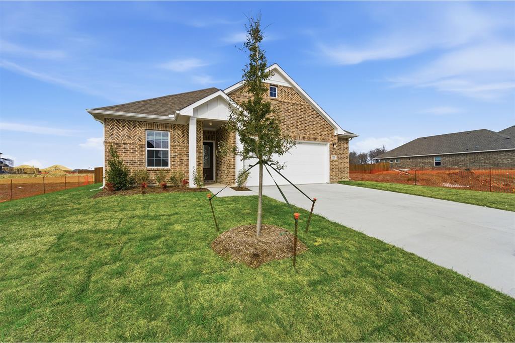 225 Charismatic Road Waxahachie, TX 75165 - Photo 2 of 21 a view of a house with a yard