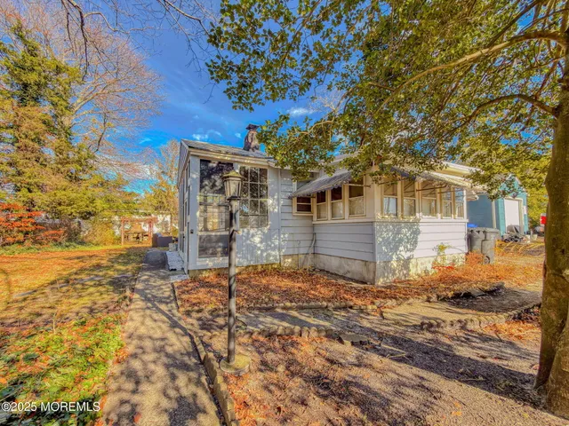 a view of a house with a tree