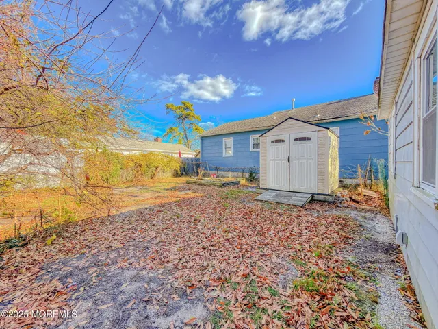a view of a yard with large tree