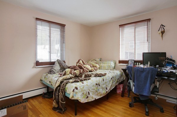 71 Colborne Road, Unit 1B Boston, MA 02135 - Photo 5 of 7 a bed room with furniture and a window