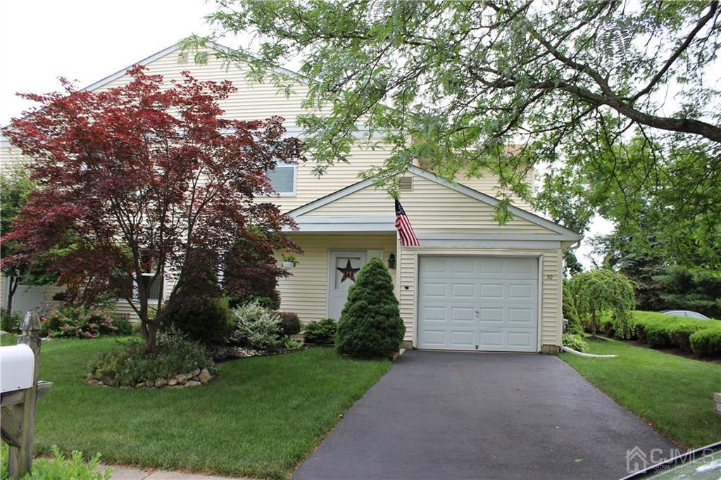 30 Pebble Road East Windsor, NJ 08520 - Photo 1 of 15 a house that has a tree in front of the house