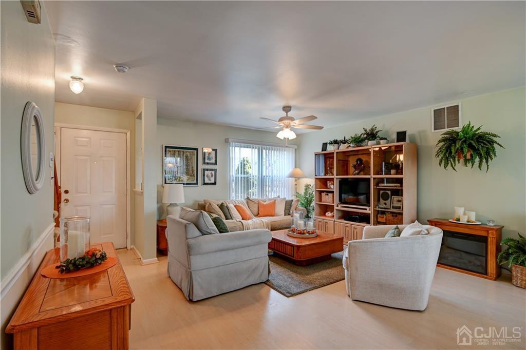 30 Pebble Road East Windsor, NJ 08520 - Photo 3 of 15 a living room with furniture and a flat screen tv