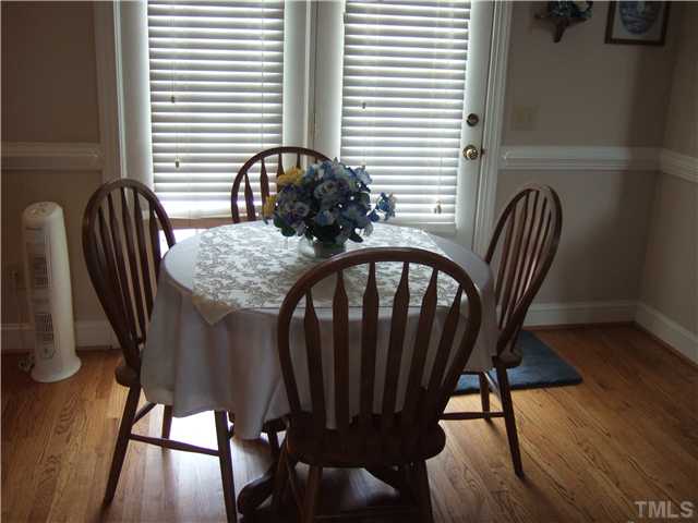 722 Blackard Road Roxboro, NC 27574 - Photo 13 of 22 a view of a dining room with furniture window and wooden floor