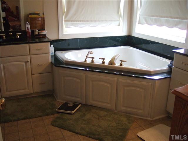722 Blackard Road Roxboro, NC 27574 - Photo 8 of 22 a kitchen with a sink and a toilet