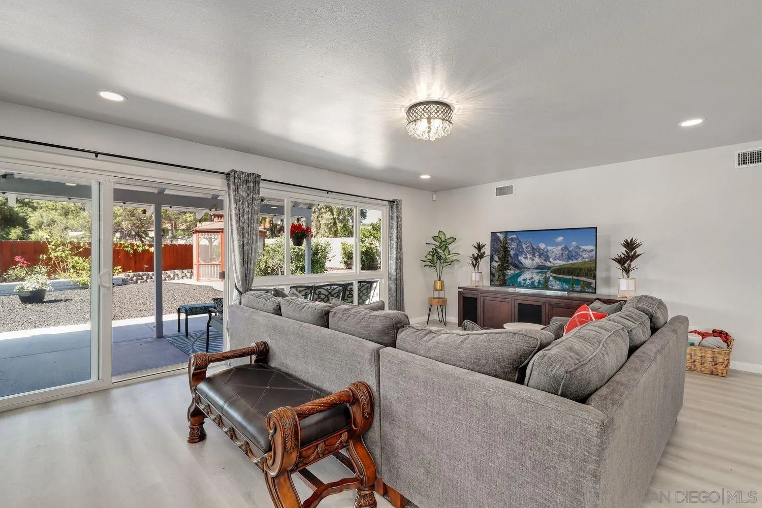 12496 Bodega Road San Diego, CA 92128 - Photo 11 of 44 a living room with furniture and a large window