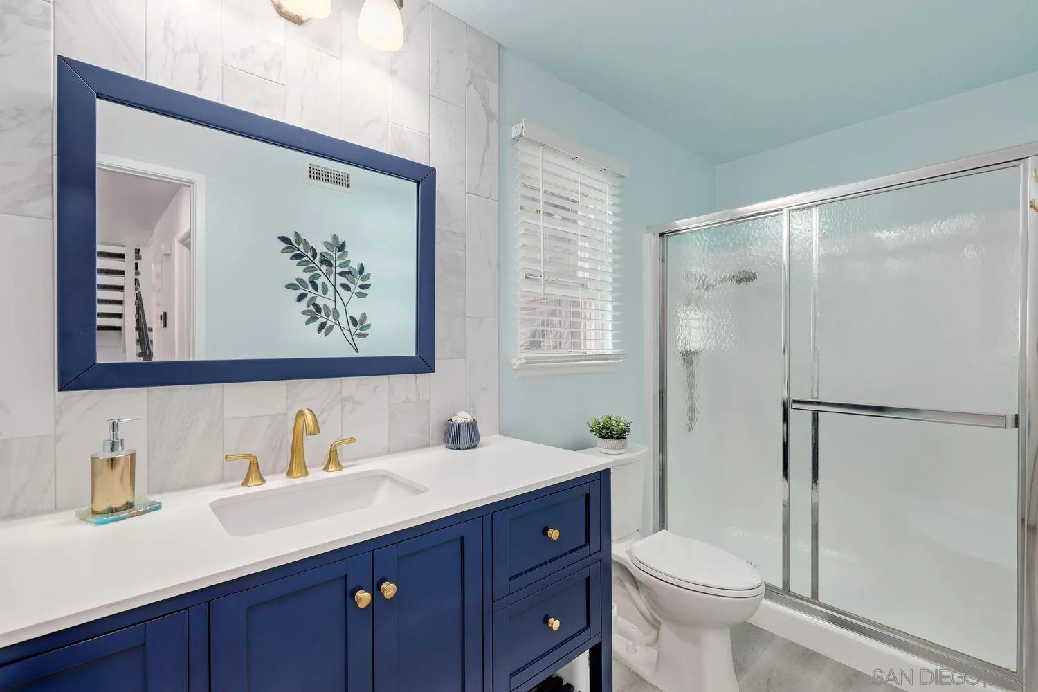 12496 Bodega Road San Diego, CA 92128 - Photo 14 of 44 a bathroom with a sink vanity mirror and toilet