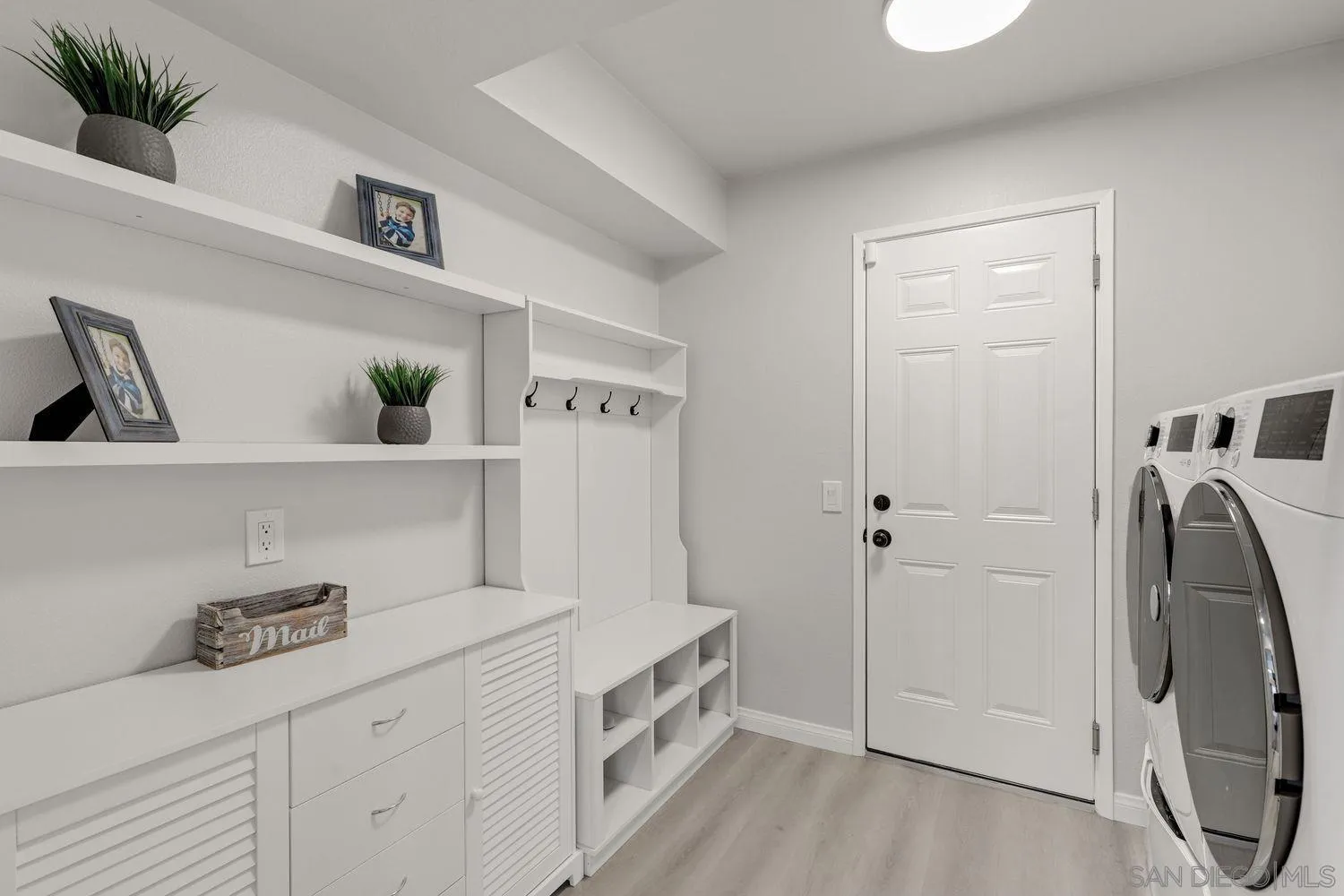 12496 Bodega Road San Diego, CA 92128 - Photo 15 of 44 a bathroom with a sink and a washer dryer