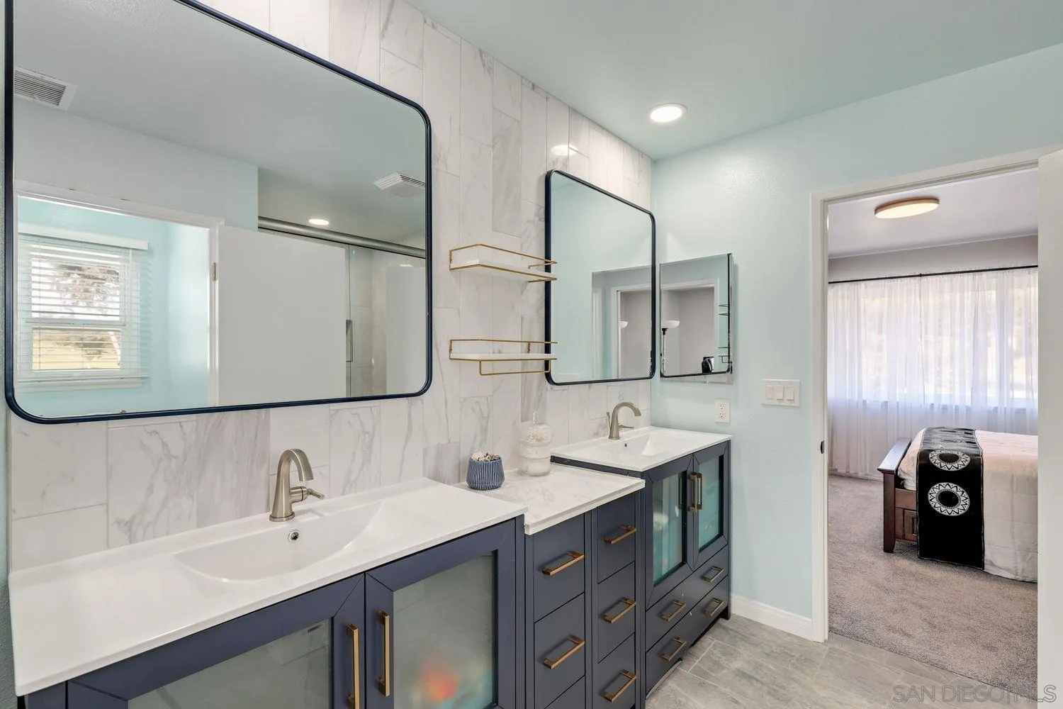 12496 Bodega Road San Diego, CA 92128 - Photo 18 of 44 a bathroom with a double vanity sink and a mirror