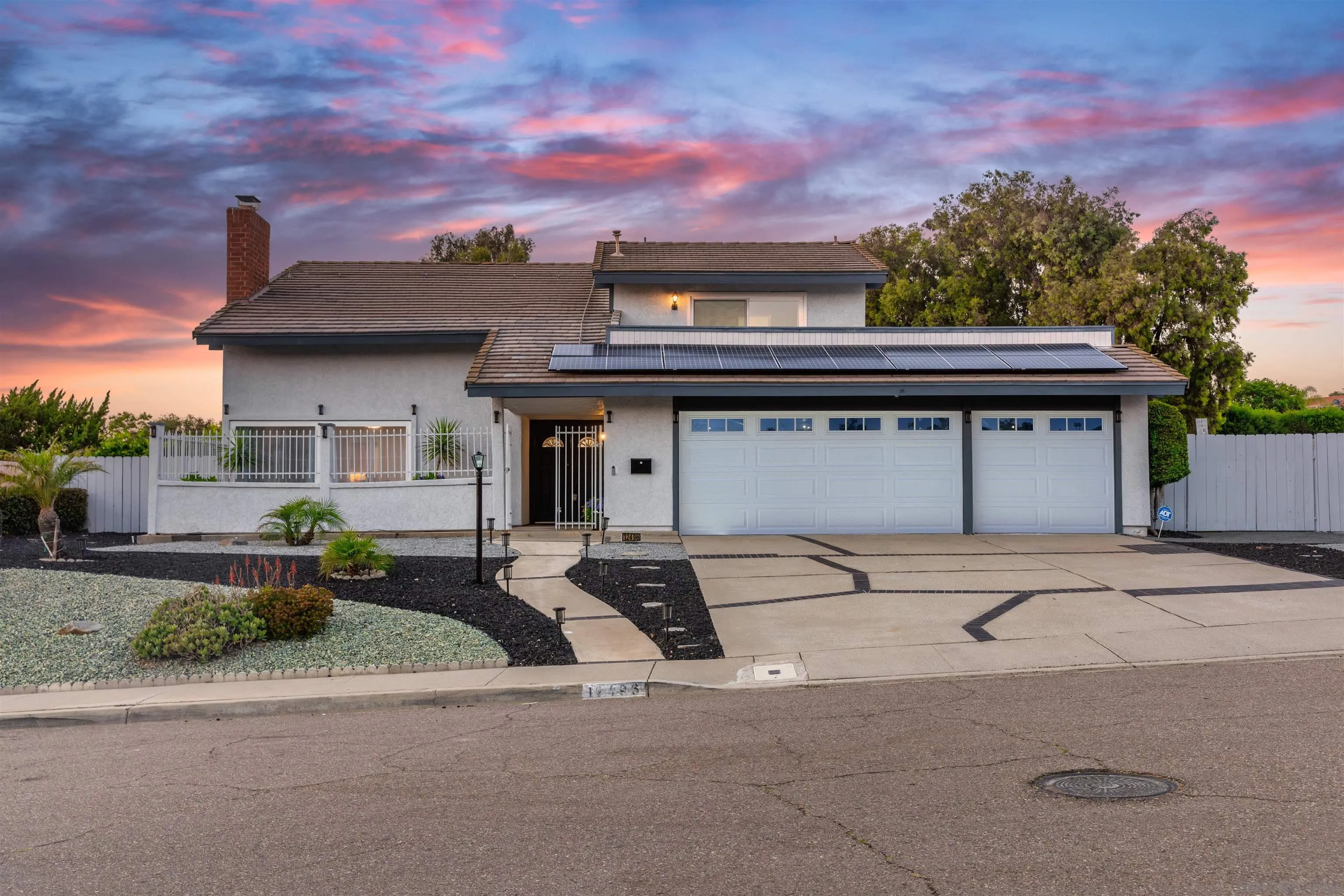 12496 Bodega Road San Diego, CA 92128 - Photo 2 of 44 a front view of a house with garage