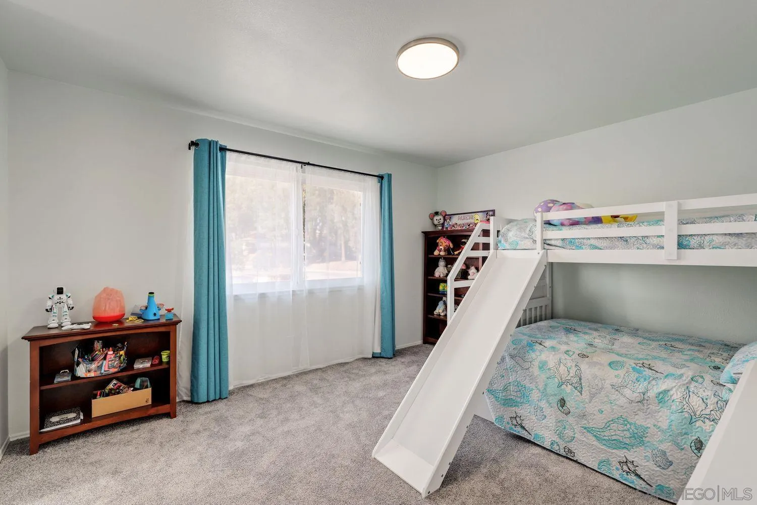 12496 Bodega Road San Diego, CA 92128 - Photo 22 of 44 a room with toys and storage