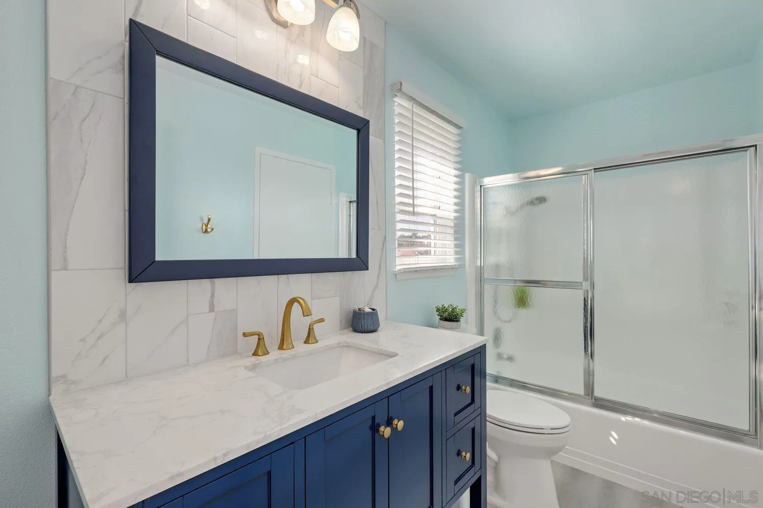 12496 Bodega Road San Diego, CA 92128 - Photo 23 of 44 a bathroom with a sink a toilet and a mirror
