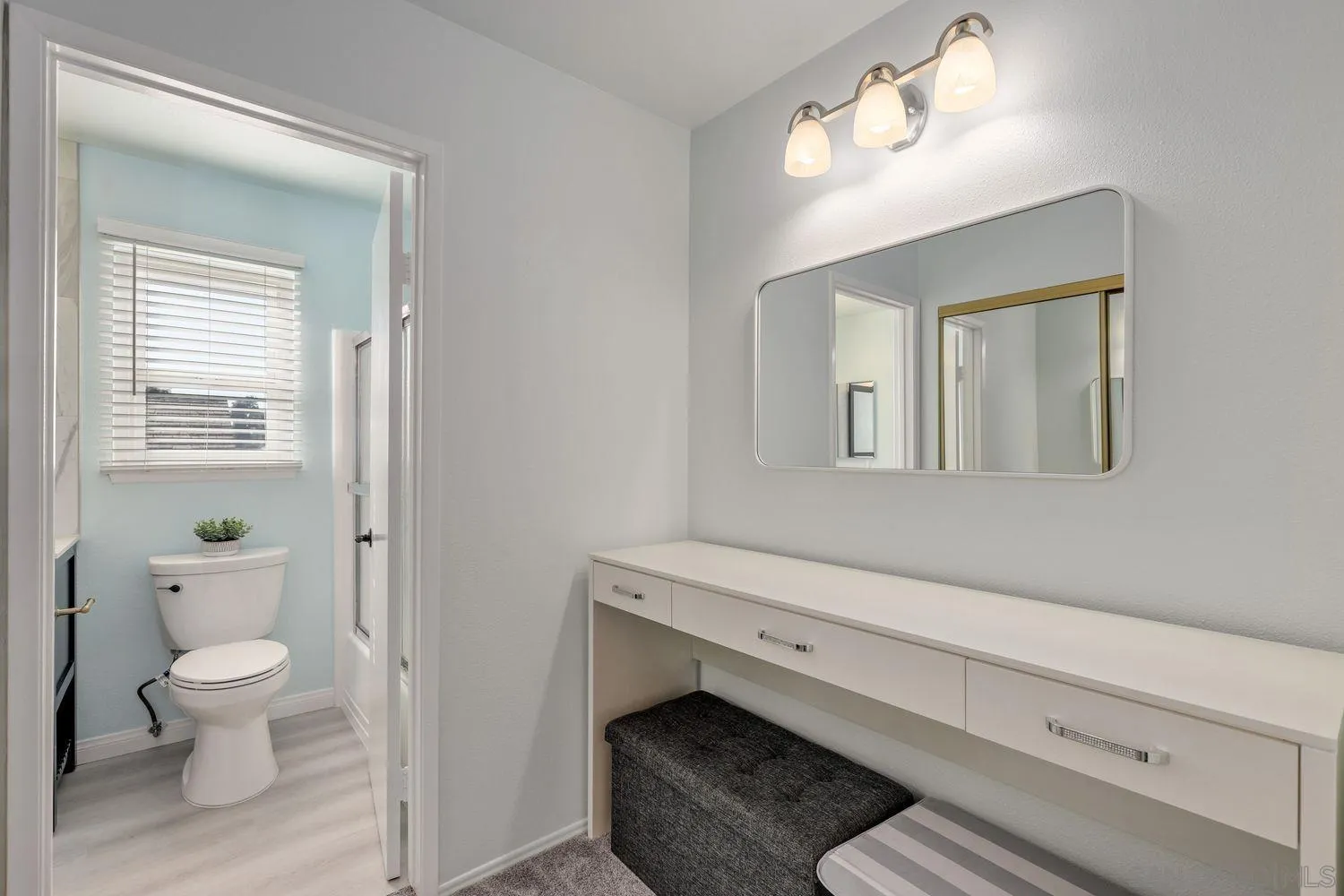 12496 Bodega Road San Diego, CA 92128 - Photo 24 of 44 a bathroom with a toilet sink and mirror