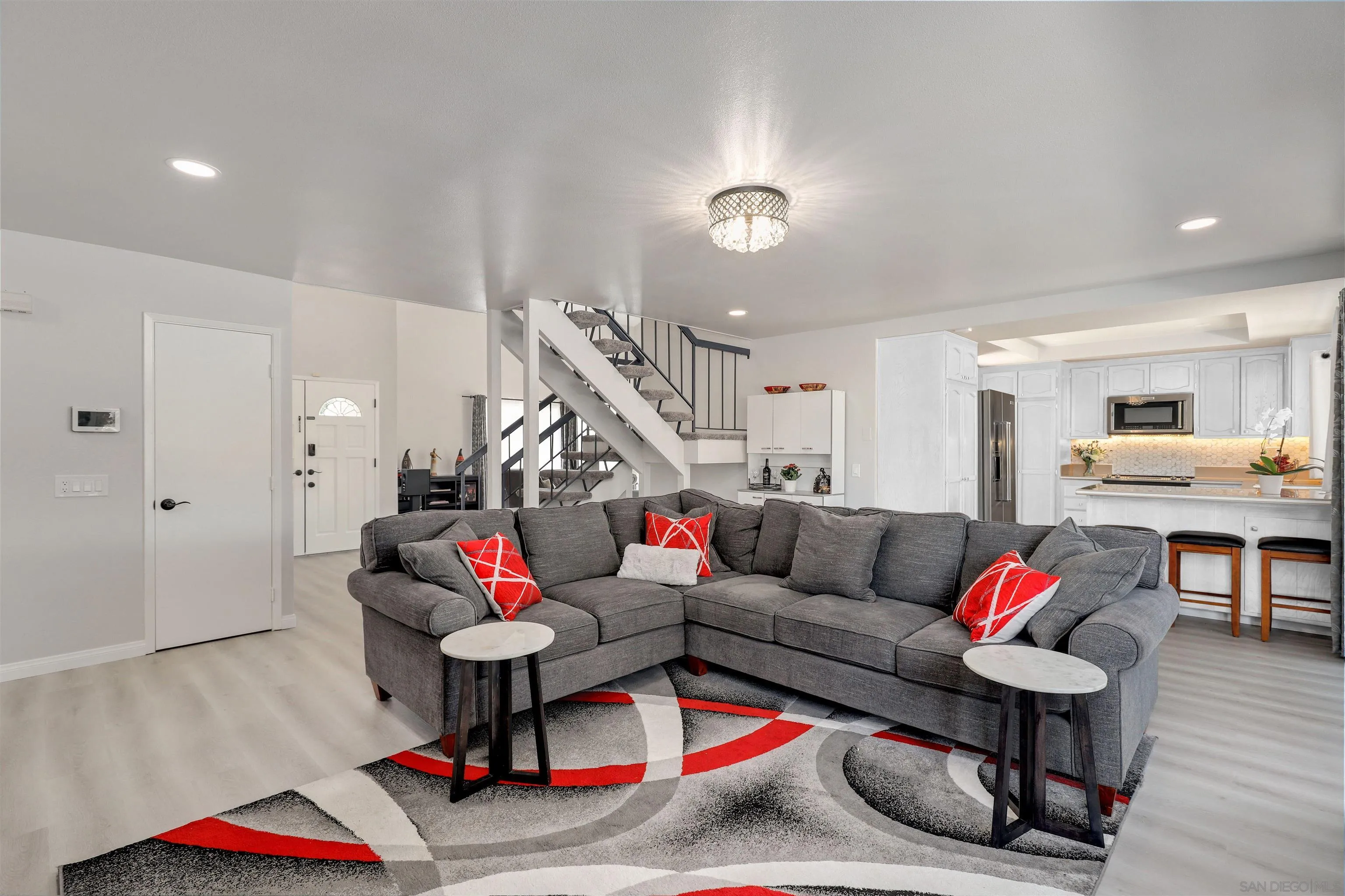 12496 Bodega Road San Diego, CA 92128 - Photo 10 of 44 a living room with furniture kitchen view and wooden floor