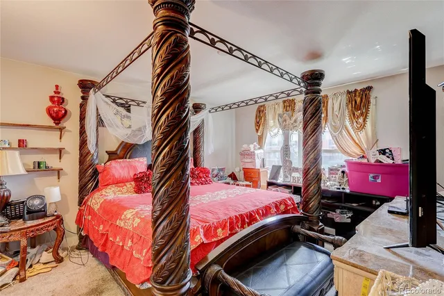 a bedroom with a bed and a closet