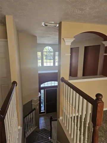 a white toilet sitting next to a small sink