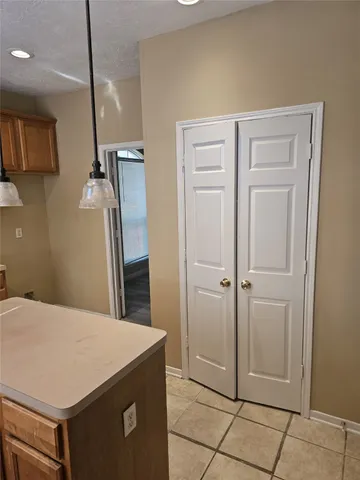a kitchen with stainless steel appliances a refrigerator and cabinets