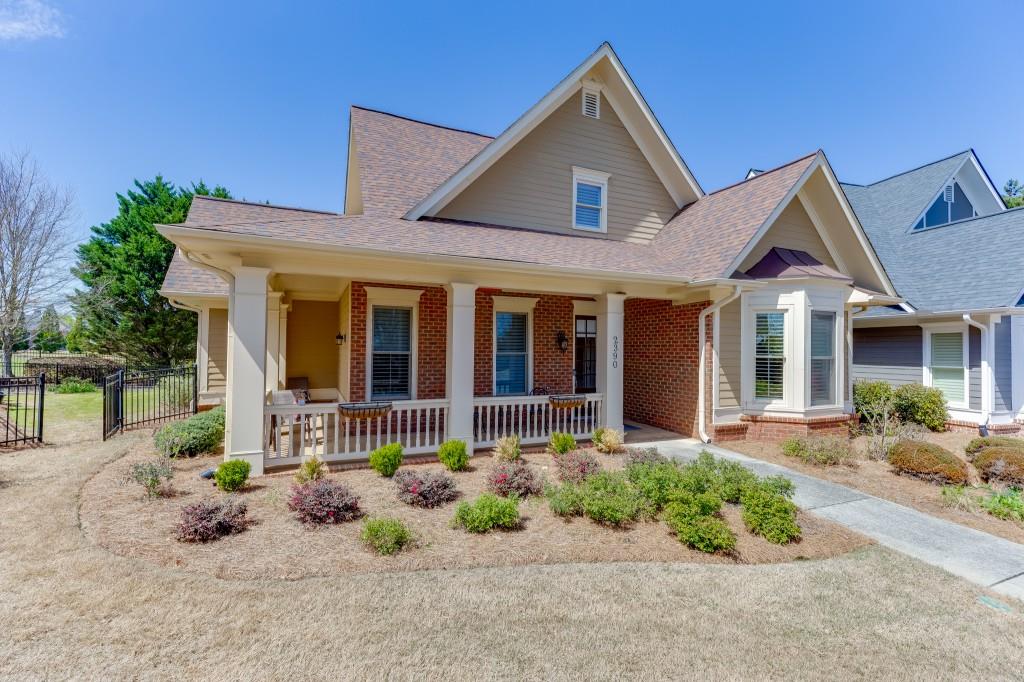 a front view of a house with garden