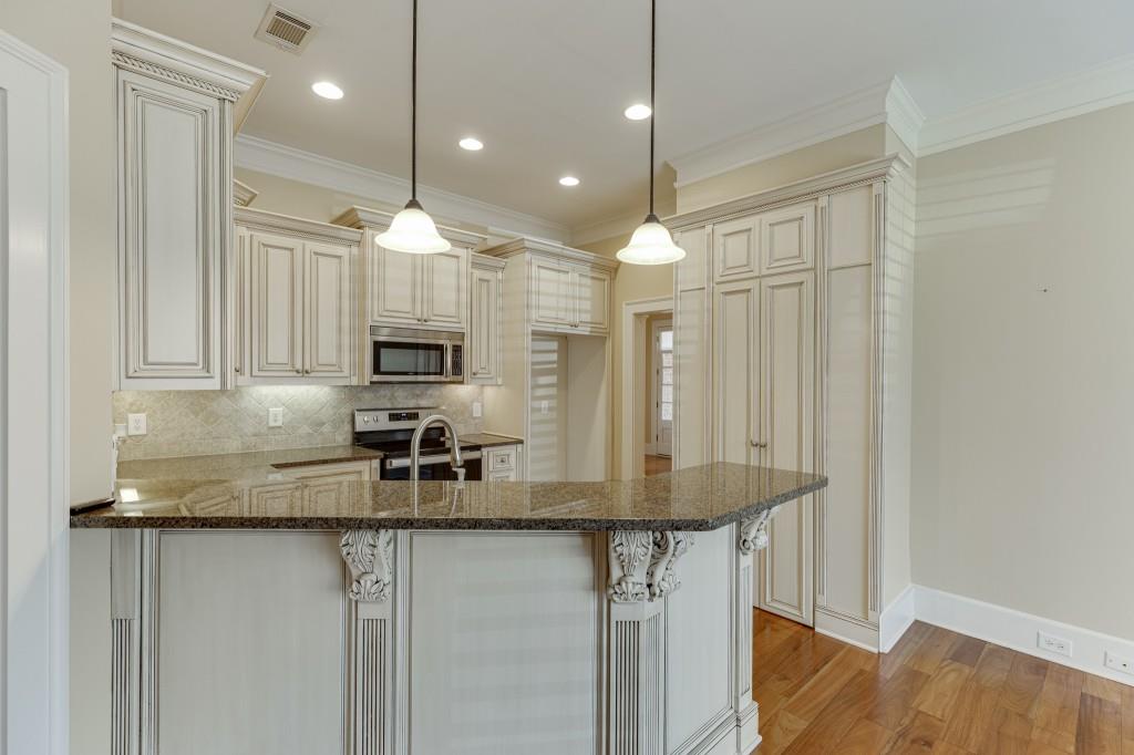 2390 Muskogee Lane Braselton, GA 30517 - Photo 12 of 40 a kitchen with stainless steel appliances granite countertop a sink refrigerator and cabinets