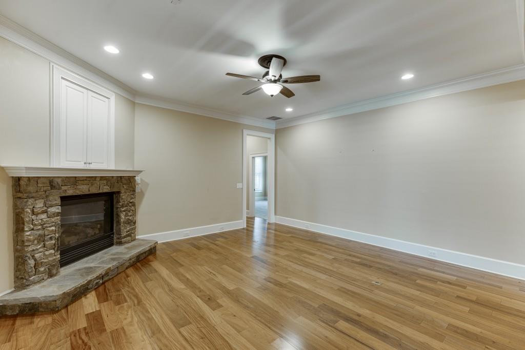2390 Muskogee Lane Braselton, GA 30517 - Photo 15 of 40 an empty room with windows and fireplace