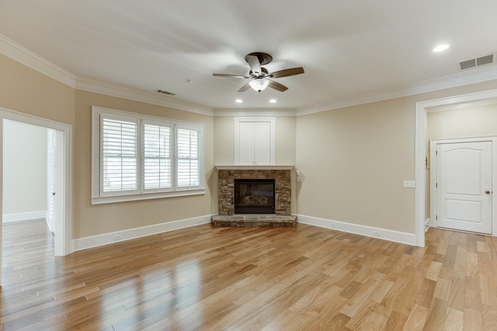 2390 Muskogee Lane Braselton, GA 30517 - Photo 16 of 40 an empty room with windows and fireplace