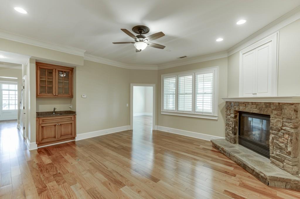2390 Muskogee Lane Braselton, GA 30517 - Photo 17 of 40 a view of an empty room with a fireplace and a window