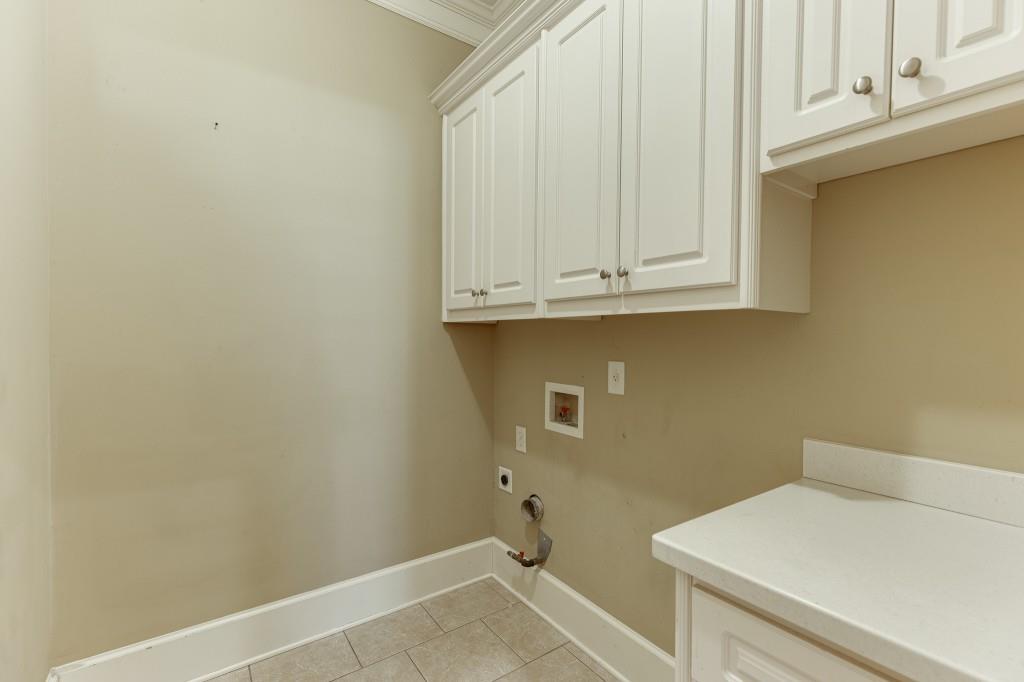 2390 Muskogee Lane Braselton, GA 30517 - Photo 18 of 40 a bathroom with a sink and cabinets