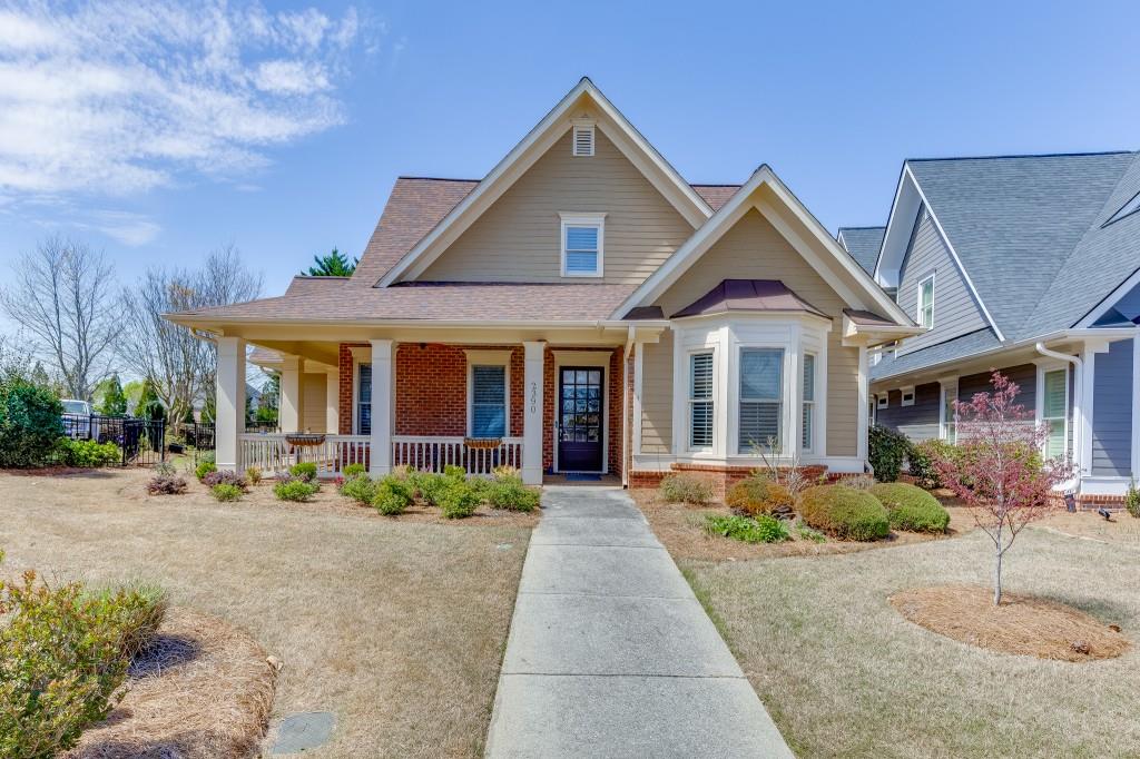 2390 Muskogee Lane Braselton, GA 30517 - Photo 2 of 40 a front view of a house with garden