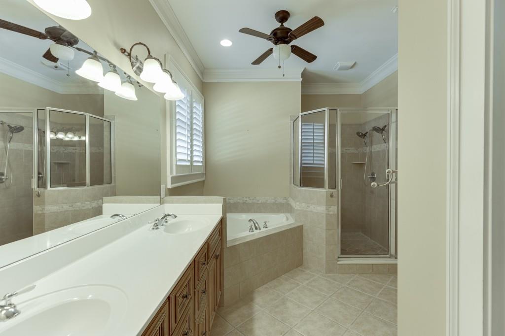 2390 Muskogee Lane Braselton, GA 30517 - Photo 21 of 40 a spacious bathroom with a double vanity sink mirror and bathtub