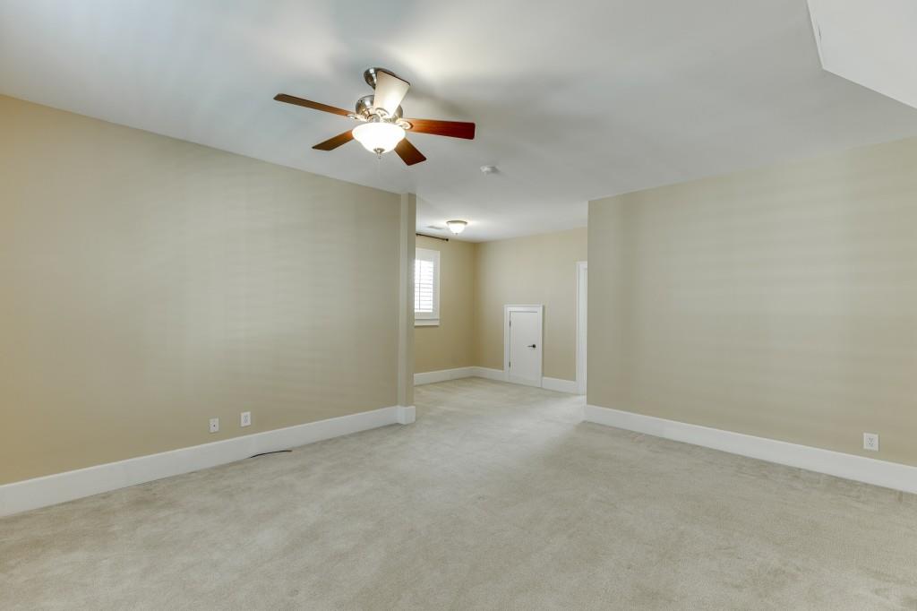 2390 Muskogee Lane Braselton, GA 30517 - Photo 31 of 40 en view of an empty room and chandelier fan