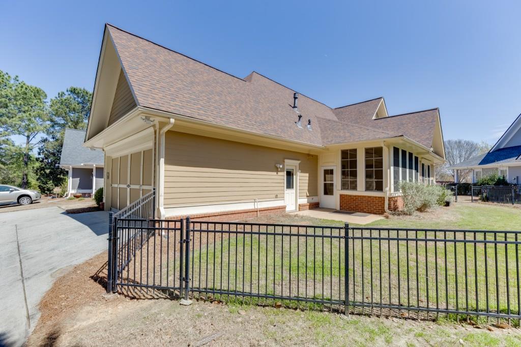 2390 Muskogee Lane Braselton, GA 30517 - Photo 36 of 40 a front view of a house with a fence
