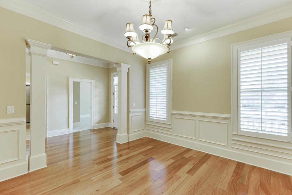 2390 Muskogee Lane Braselton, GA 30517 - Photo 6 of 40 a view of an empty room with wooden floor and a window
