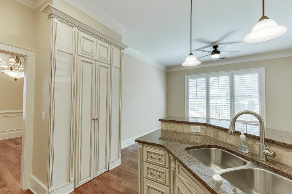 2390 Muskogee Lane Braselton, GA 30517 - Photo 9 of 40 a close view of a sink a faucet and chandelier