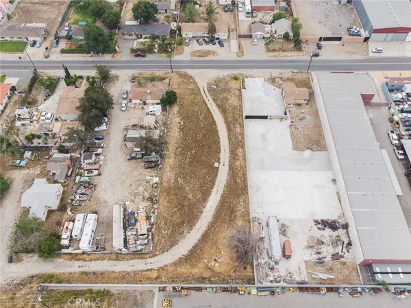 an aerial view of a house with yard