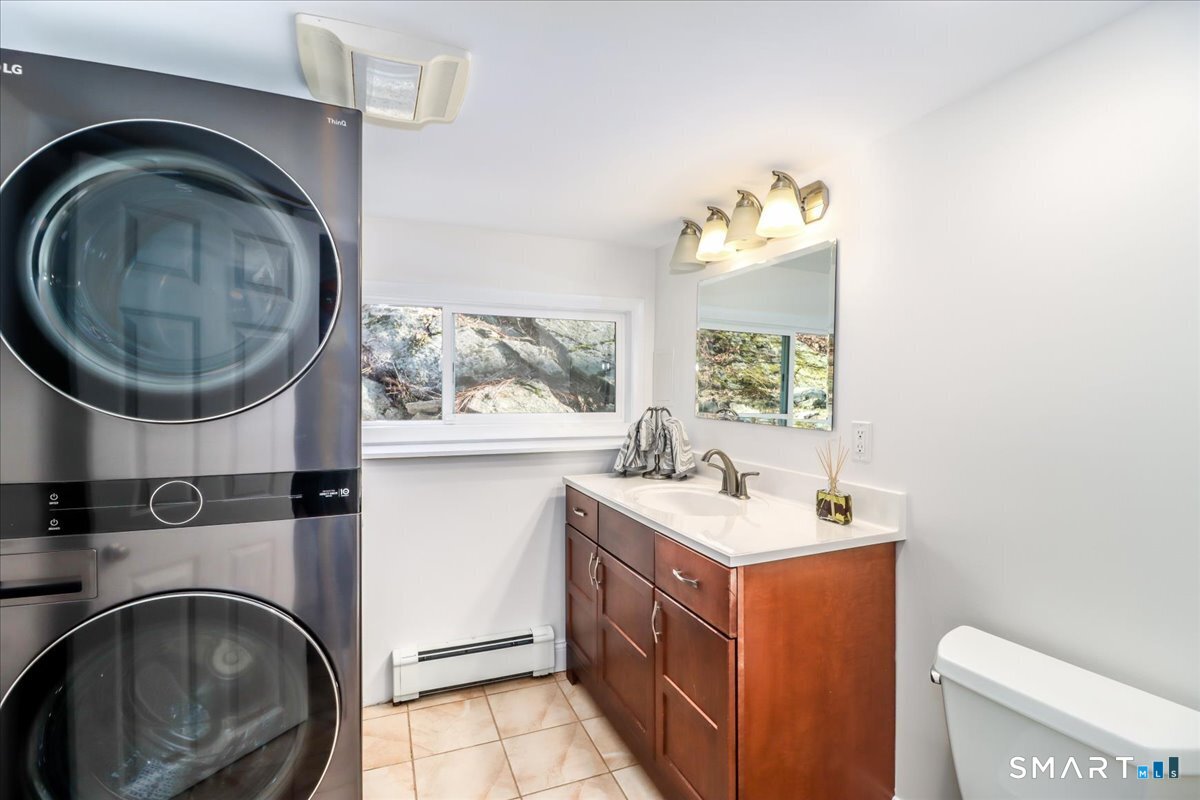 8 Summit Lane Ridgefield, CT 06877 - Photo 16 of 40 a bathroom with a sink mirror vanity and toilet