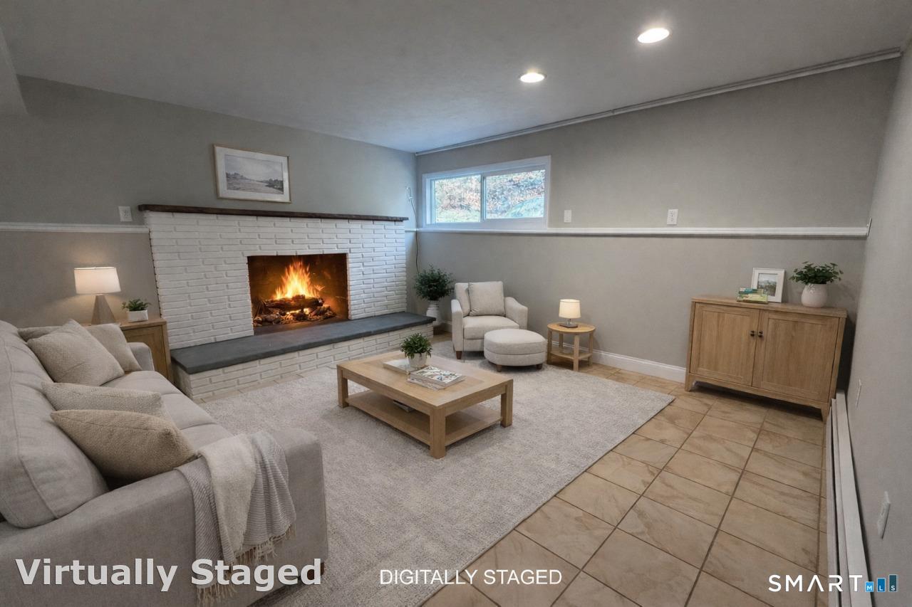 8 Summit Lane Ridgefield, CT 06877 - Photo 26 of 40 a living room with furniture and a flat screen tv