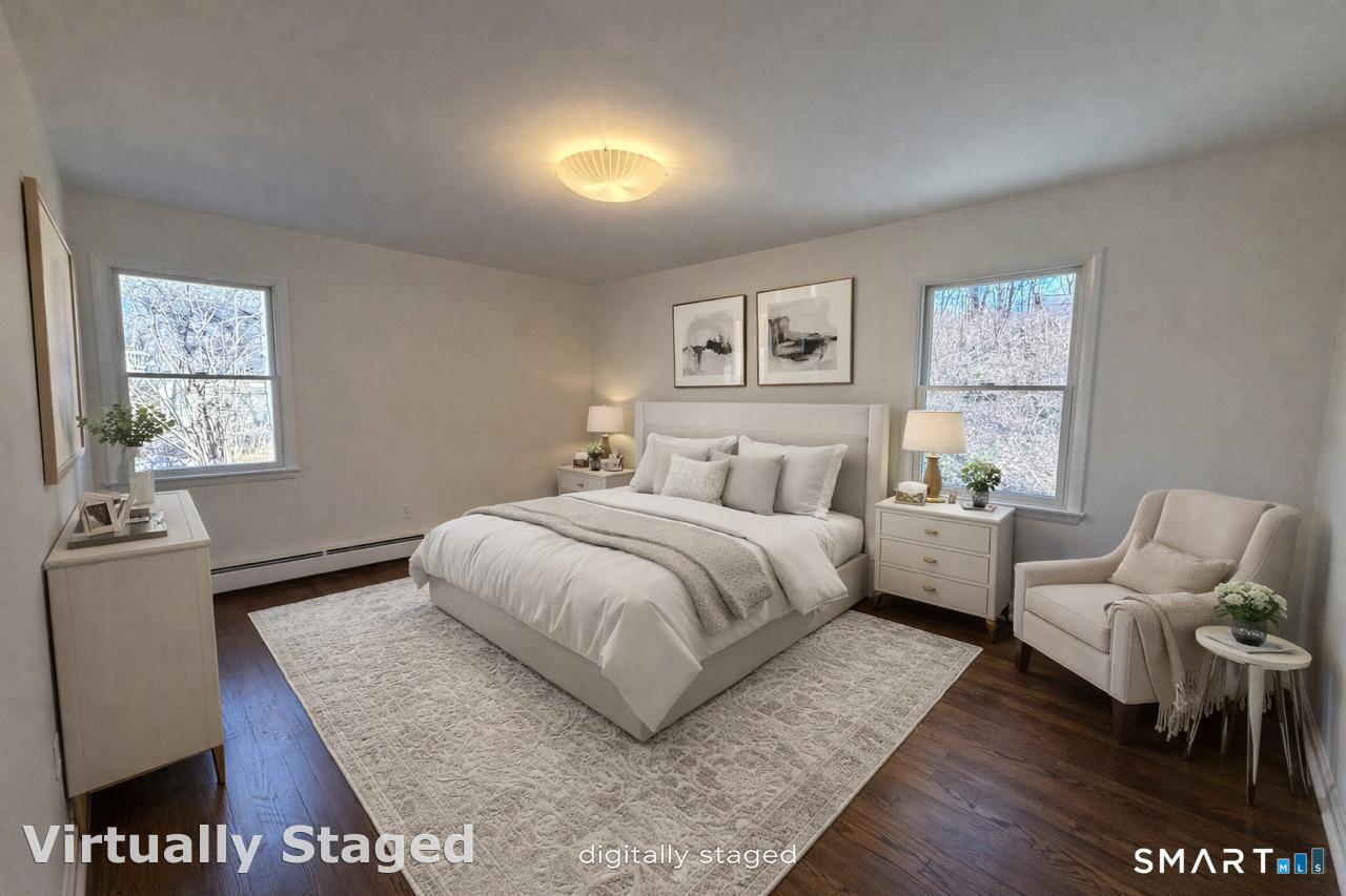 8 Summit Lane Ridgefield, CT 06877 - Photo 28 of 40 a bedroom with a bed and wooden floor