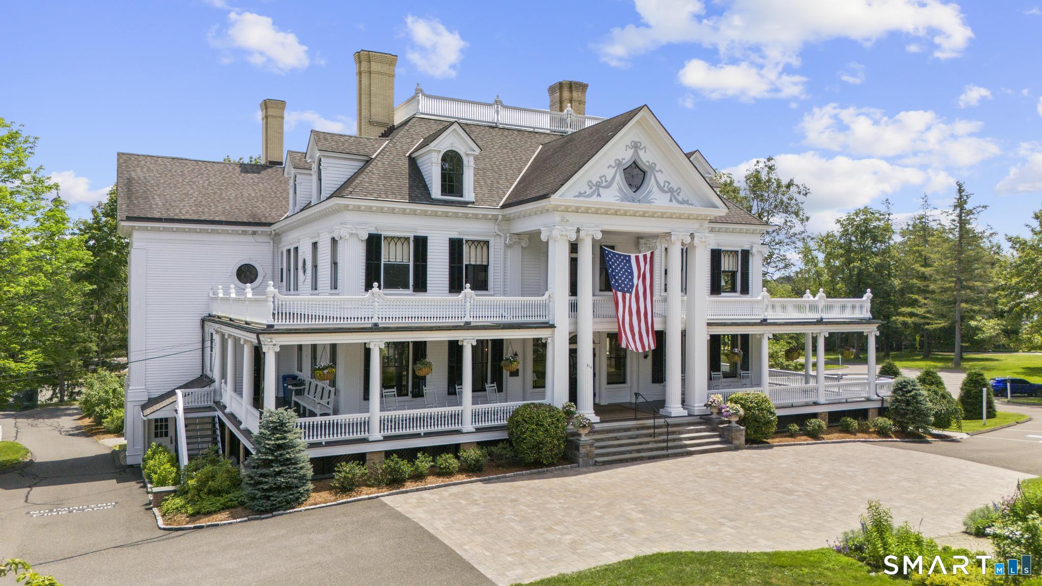 8 Summit Lane Ridgefield, CT 06877 - Photo 38 of 40 a front view of a house with garden and trees