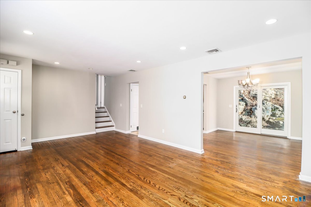 8 Summit Lane Ridgefield, CT 06877 - Photo 9 of 40 a view of an empty room with wooden floor and a window