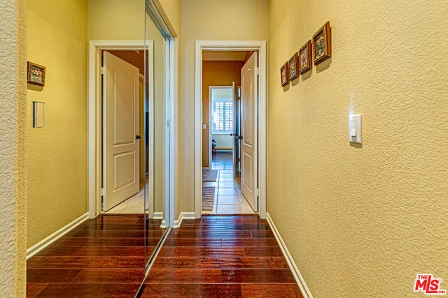 a kitchen with stainless steel appliances granite countertop sink stove and wooden cabinets