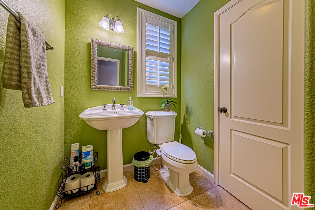 23208 Maple Avenue Torrance, CA 90505 - Photo 27 of 62 a bathroom with a sink and a mirror
