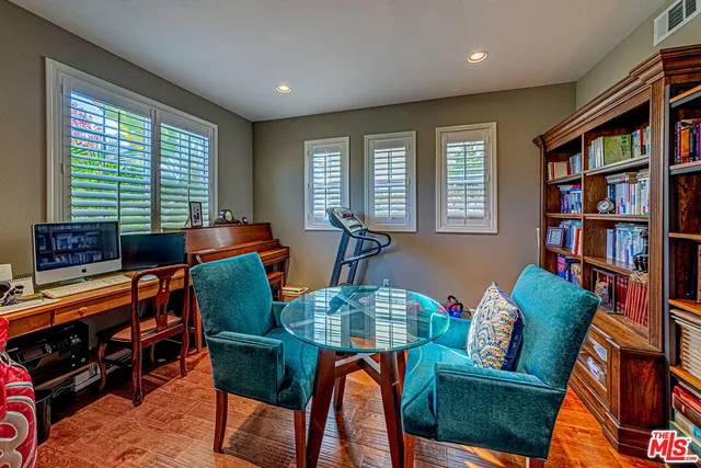 a view of entryway livingroom and hall with wooden floor