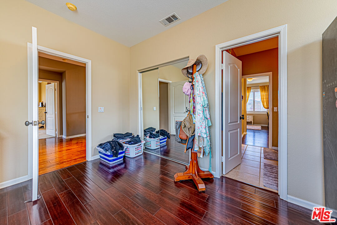 23208 Maple Avenue Torrance, CA 90505 - Photo 34 of 62 a living room with furniture and a wooden floor